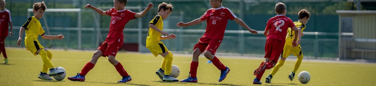 Children Learning Football